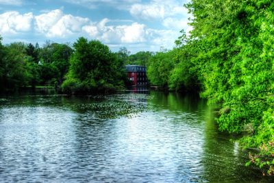 Scenic view of lake against cloudy sky