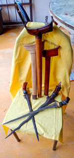 High angle view of yellow container on table