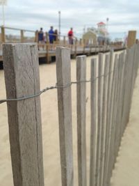 Close-up of sand at beach against sky