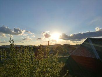 Scenic view of field against sky during sunset