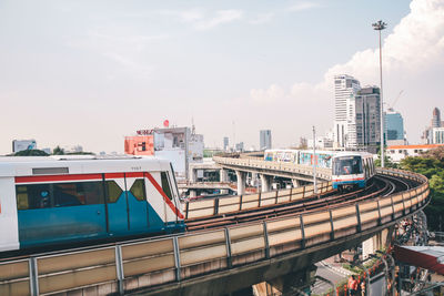 High angle view of train against buildings in city