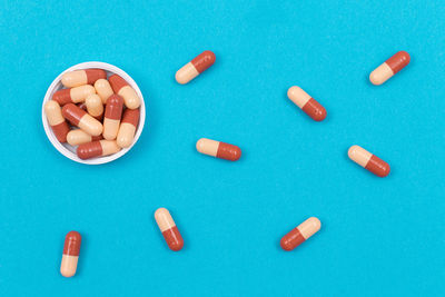 High angle view of blue eggs on green background