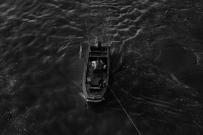 High angle view of people on boat in sea