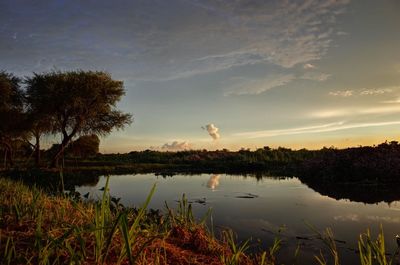 Scenic view of lake against sky during sunset