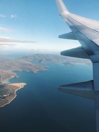 Aerial view of airplane wing over landscape