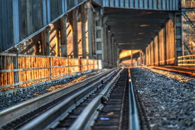 Railroad tracks by bridge