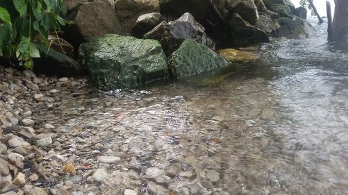 View of water flowing through rocks