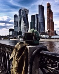 Skyscrapers against cloudy sky