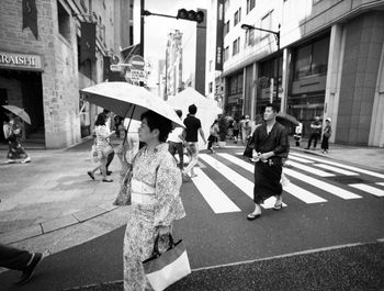 GROUP OF PEOPLE IN CITY