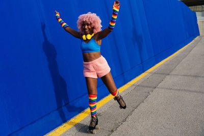 Low section of woman jumping on road