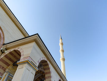 Low angle view of building against clear blue sky