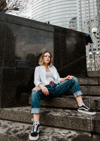 Portrait of teenage girl sitting outdoors