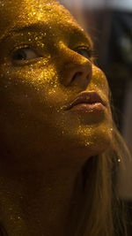Close-up of woman face with glitters