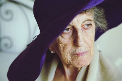Senior woman of 78 years old in the hat with wide brims. closeup