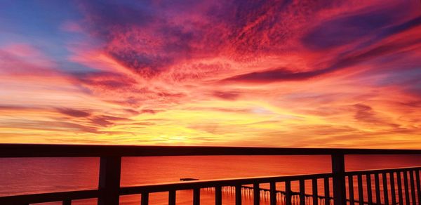 Scenic view of sea against orange sky