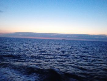 Scenic view of sea against clear sky during sunset