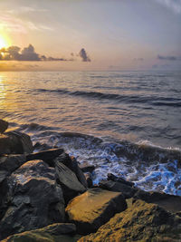 Scenic view of sea against sky during sunset