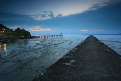 Pier over sea against sky