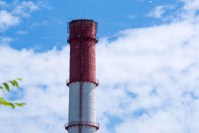 Low angle view of smoke stack against sky