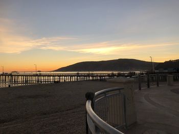 Scenic view of beach against sky during sunset