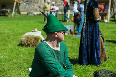 Rear view of man looking at field