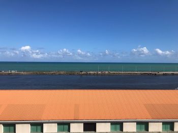 Scenic view of sea against blue sky