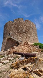 Low angle view of old ruins against sky