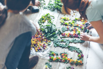 High angle view of girls playing on floor