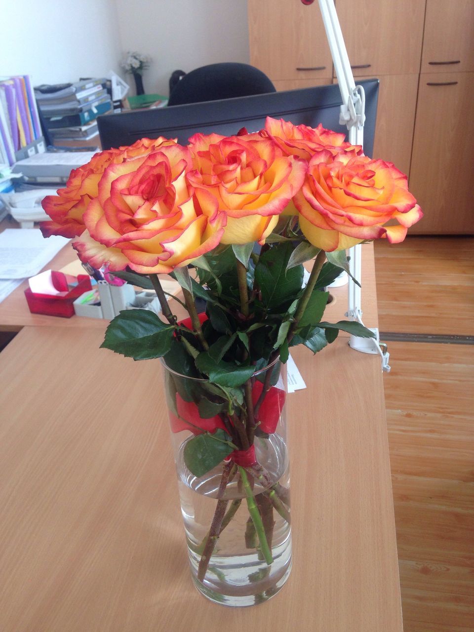 flower, table, vase, petal, rose - flower, fragility, indoors, freshness, artificial, no people, flower head, nature, beauty in nature, close-up, bouquet, multi colored, red, day