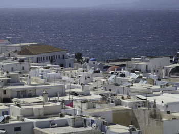 High angle view of townscape by sea - mykonos view from above with the old port in the background