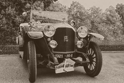 Close-up of old vintage car on field