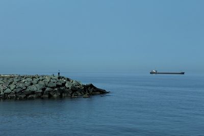 Scenic view of sea against clear blue sky