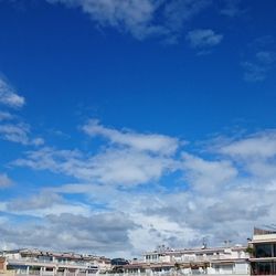 Low angle view of building against blue sky