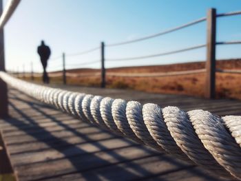 Close-up of rope on footbridge