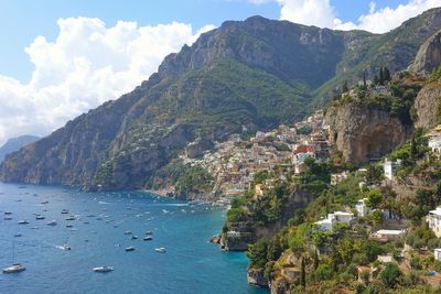 Scenic view of sea and mountains against sky - positano amalfi coast