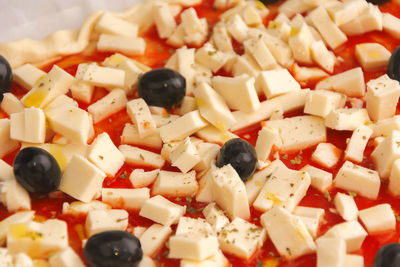 Close up of a raw pizza ready to be baked 