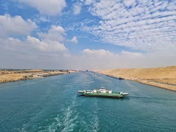 Boats in sea against sky