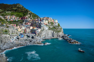 Panoramic view of sea against clear blue sky