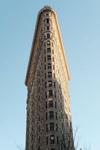 Low angle view of building against clear blue sky flatiron building 