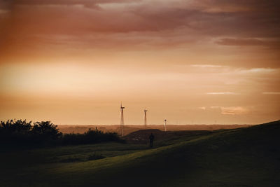 Scenic view of rural landscape at sunset