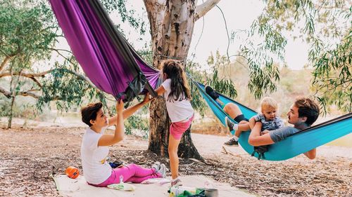 Family enjoying picnic at park