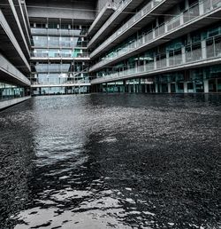 Modern building by river in city