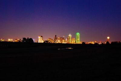 Silhouette of city skyline at night