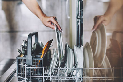 Midsection of woman preparing food at home