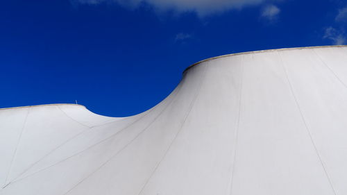 Low angle view of white building against blue sky