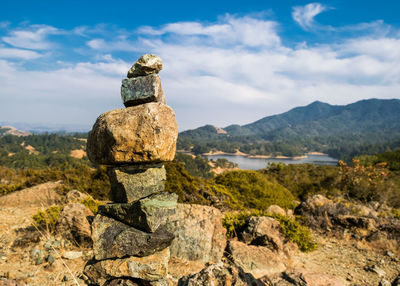 Stack of rocks on landscape against sky in national park 