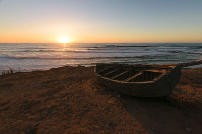 Scenic view of sea against clear sky during sunset