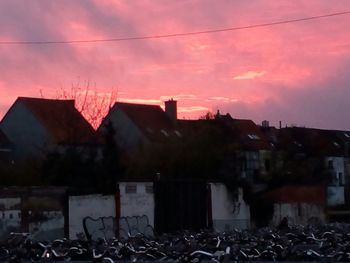 Buildings against sky at sunset