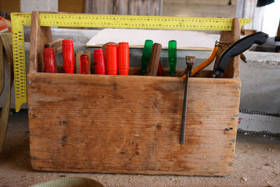 Close-up of work tools in wooden box