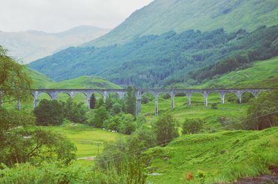 Scenic view of landscape, mountains and viaduct. park of harry potter movie was shot here.